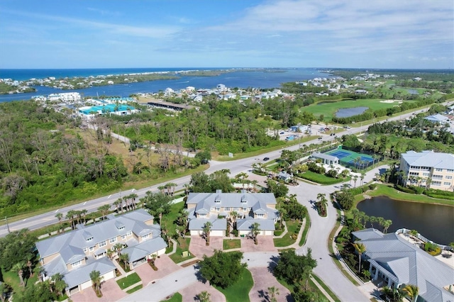 birds eye view of property featuring a water view and a residential view