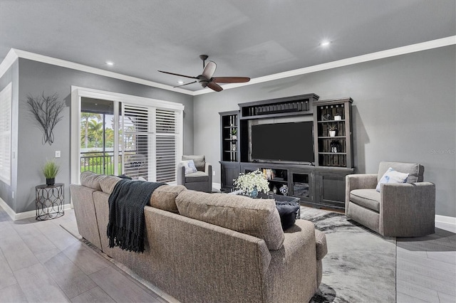 living room with recessed lighting, a ceiling fan, baseboards, and ornamental molding