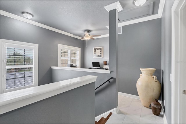 hallway with visible vents, an upstairs landing, marble finish floor, a textured ceiling, and baseboards