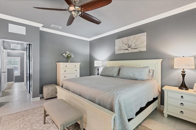 bedroom with visible vents, baseboards, and crown molding