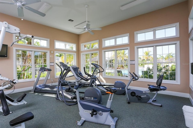 gym featuring visible vents, baseboards, and ceiling fan