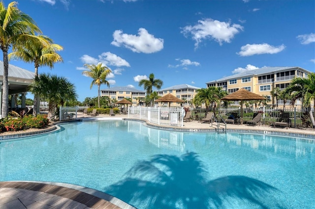 pool with a gazebo and fence