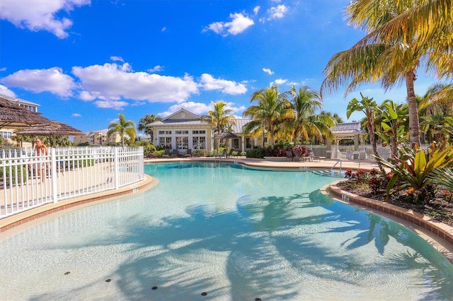 pool featuring a patio and fence