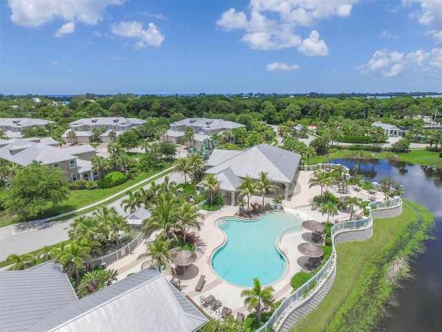 drone / aerial view with a water view and a residential view