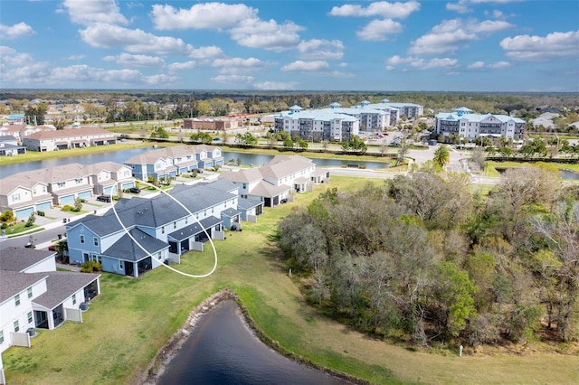 birds eye view of property featuring a water view and a residential view