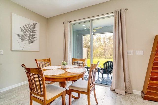 dining room with stairway and baseboards