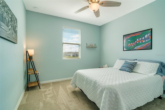 bedroom with carpet floors, baseboards, and a ceiling fan