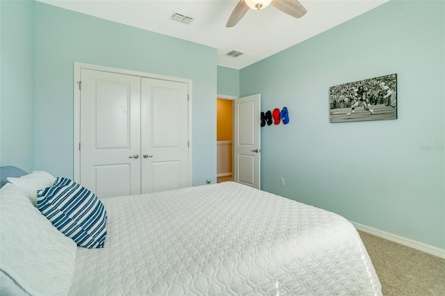 bedroom featuring carpet, a closet, visible vents, and baseboards