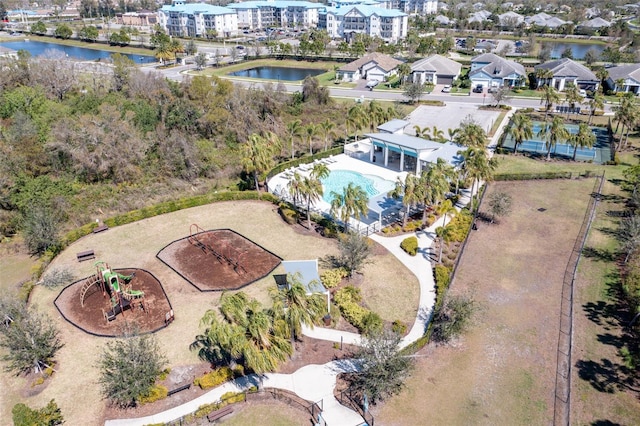 birds eye view of property with a water view