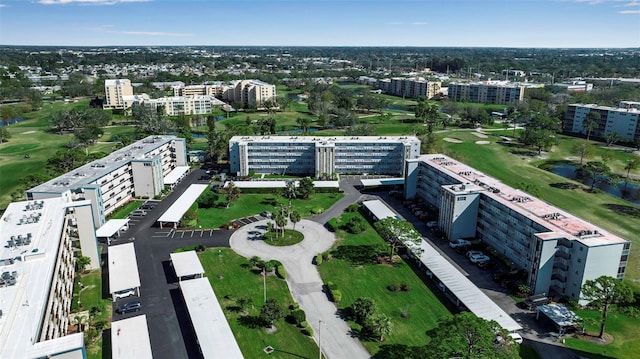 bird's eye view featuring a view of city and golf course view