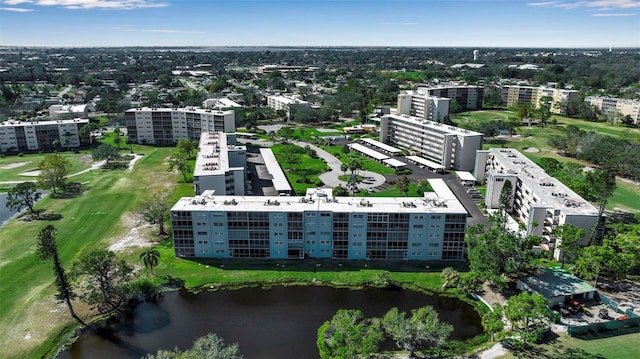 birds eye view of property featuring a water view and a city view