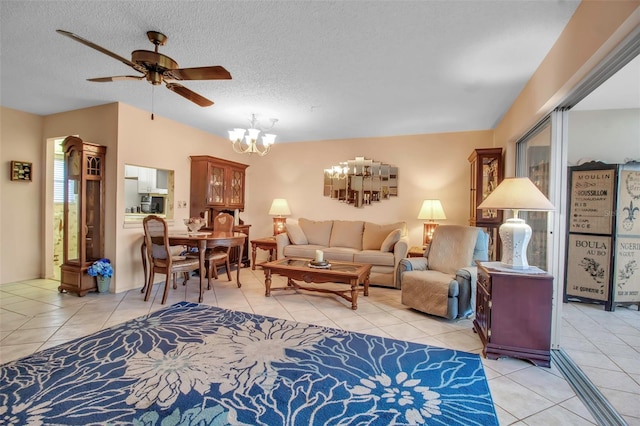 living area with vaulted ceiling, a textured ceiling, and light tile patterned floors