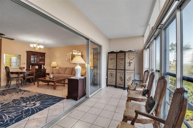 interior space featuring a chandelier and light tile patterned floors