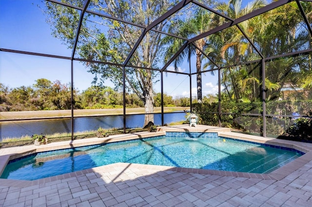 pool featuring a patio area, glass enclosure, and a water view