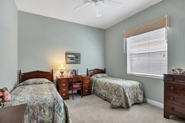 bedroom with carpet floors, a ceiling fan, and baseboards