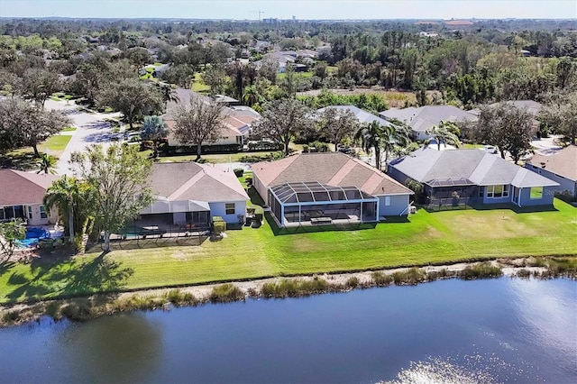 bird's eye view with a water view and a residential view