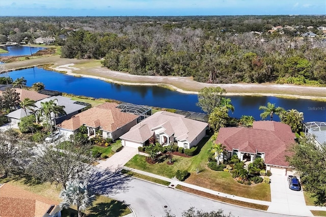 drone / aerial view with a water view and a residential view