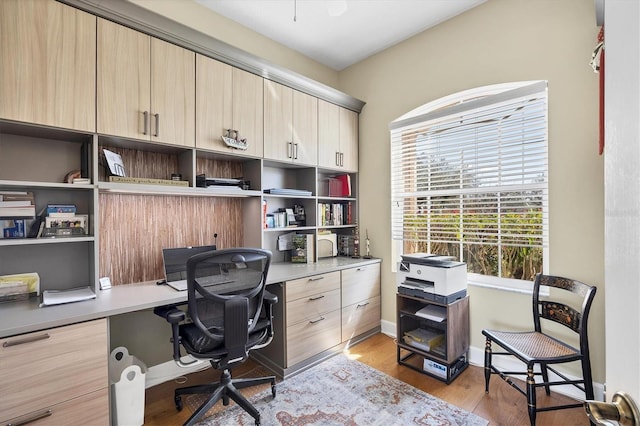office space featuring light wood-style floors and baseboards
