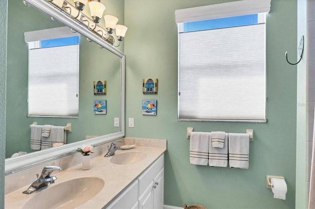 full bathroom featuring a sink and double vanity