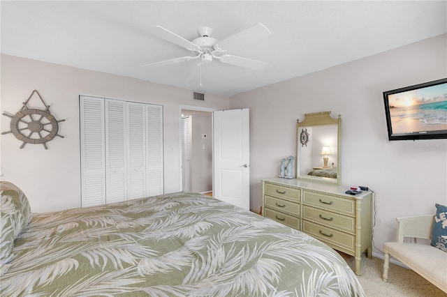 bedroom with a closet, visible vents, and ceiling fan