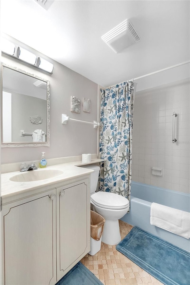 full bathroom featuring toilet, vanity, shower / bath combo with shower curtain, and visible vents