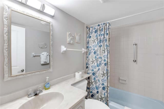 bathroom with shower / tub combo with curtain, vanity, and toilet