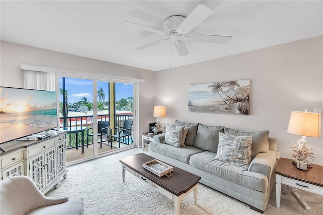 living room with light carpet and ceiling fan