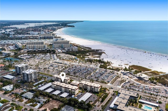 bird's eye view featuring a water view, a city view, and a view of the beach