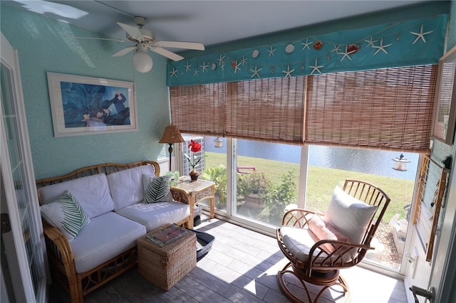 sunroom / solarium with ceiling fan