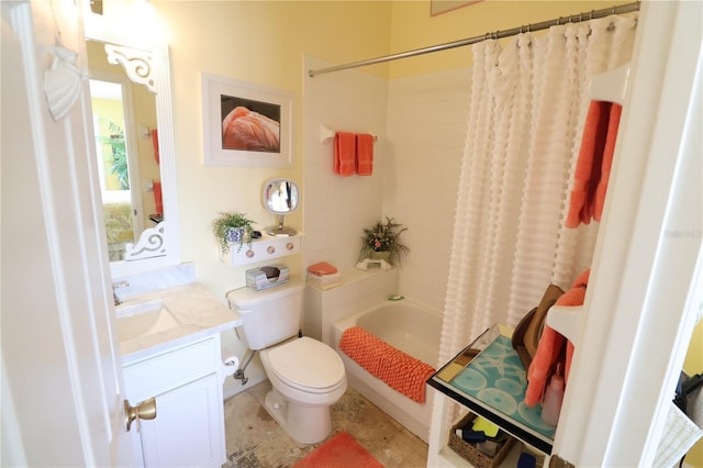 bathroom with vanity, toilet, and shower / bath combo with shower curtain