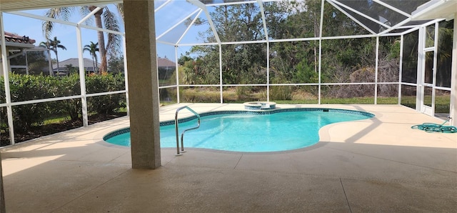 outdoor pool featuring a lanai, a patio, and a jacuzzi