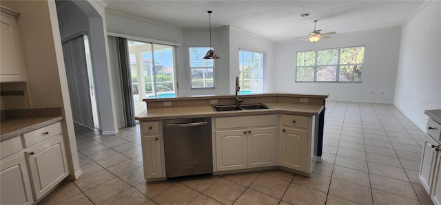 kitchen featuring ornamental molding, stainless steel dishwasher, pendant lighting, a sink, and light tile patterned flooring