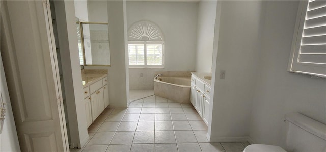 full bath featuring toilet, tile patterned flooring, a bath, and vanity