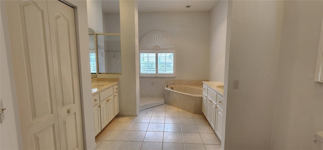 full bathroom with a garden tub, walk in shower, tile patterned flooring, and vanity