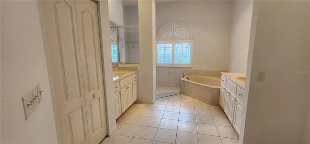 bathroom with a garden tub, vanity, tile patterned flooring, and walk in shower