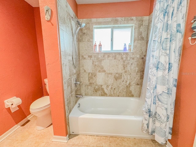 full bathroom featuring toilet, tile patterned flooring, baseboards, and shower / tub combo with curtain