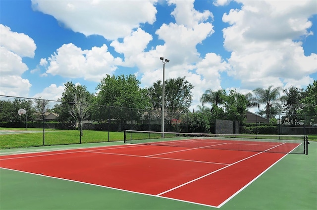 view of sport court featuring community basketball court and fence