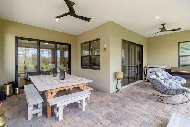 view of patio / terrace with ceiling fan, outdoor dining space, and grilling area