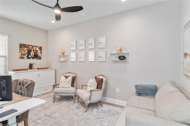 office space with light wood-type flooring, baseboards, a ceiling fan, and recessed lighting