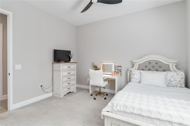 bedroom featuring light carpet, baseboards, and a ceiling fan