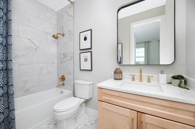 bathroom featuring toilet, bathtub / shower combination, vanity, and baseboards