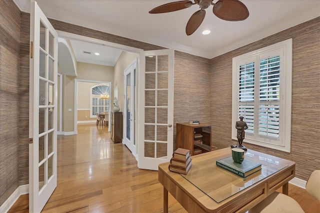 home office featuring french doors, wood-type flooring, and baseboards