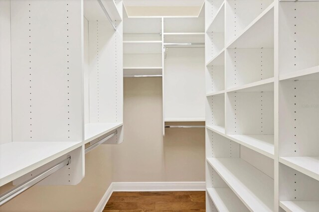 spacious closet with wood finished floors