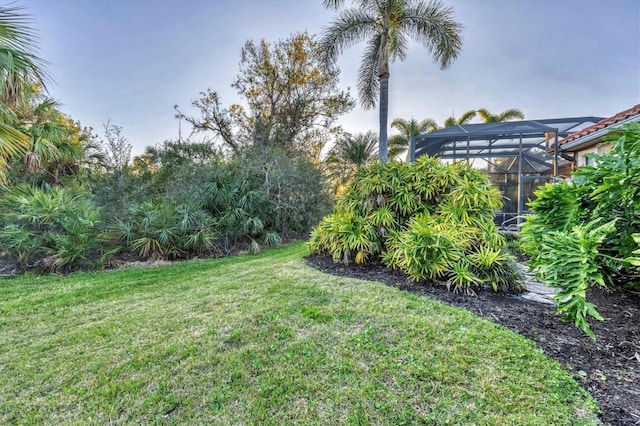 view of yard featuring a lanai