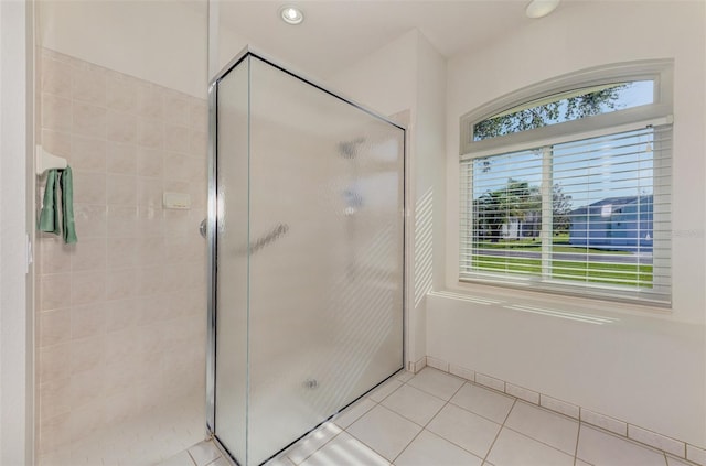 full bathroom with tile patterned floors, recessed lighting, baseboards, and a stall shower