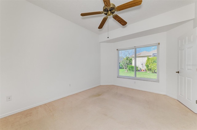 unfurnished room with ceiling fan, baseboards, and light carpet