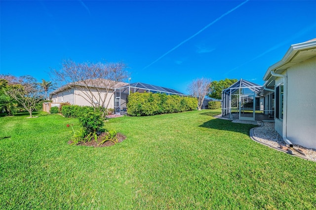 view of yard with a lanai