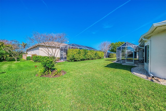5872 Mckinley Rd, Venice, FL 34293 - view of green lawn with glass enclosure