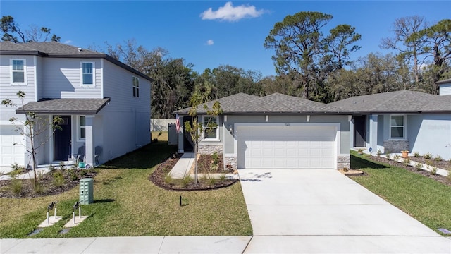 view of front facade with driveway, a garage, a shingled roof, a front lawn, and stucco siding