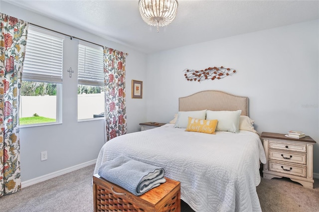 bedroom featuring carpet floors and baseboards